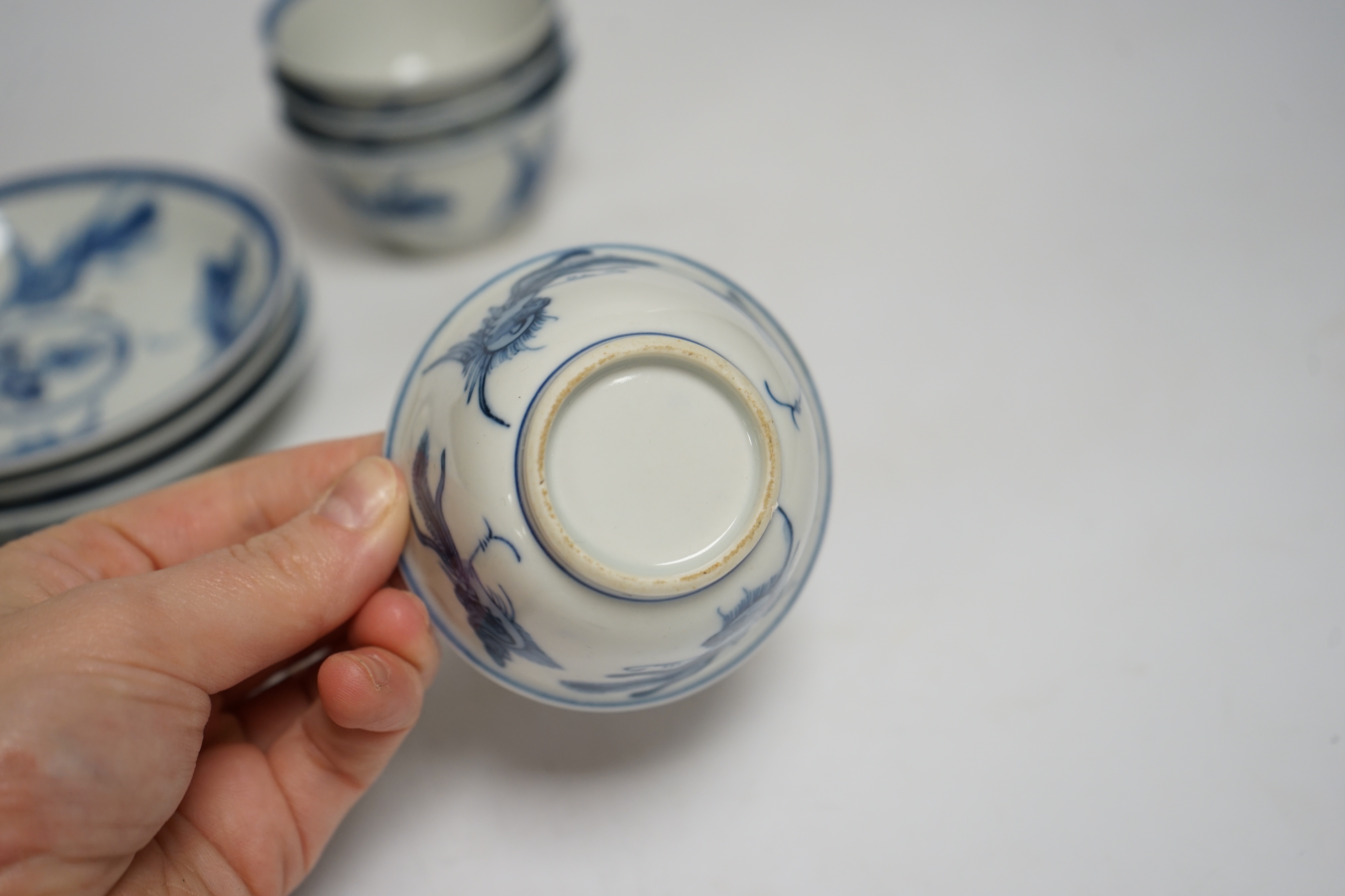 A set of four Chinese blue and white teabowls and saucers